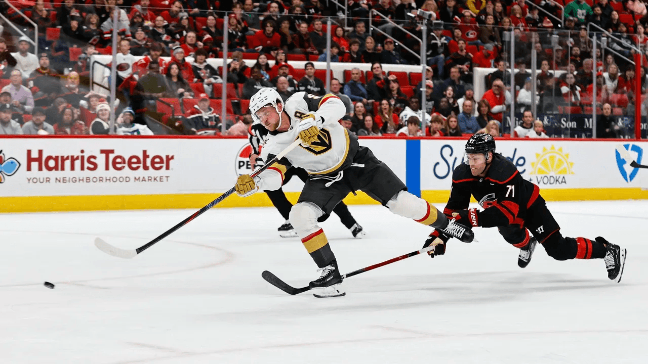 Vegas Golden Knights player skating against the Carolina Hurricanes